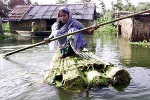 Indian woman on a raft (source: iotacourse.org)
